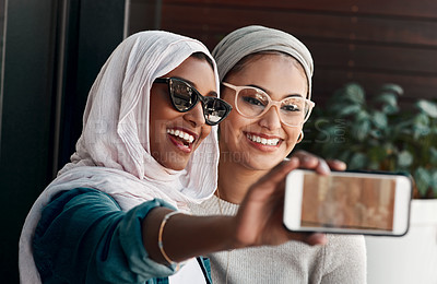 Buy stock photo Selfie, muslim people and friends with sunglasses in city for social media, influencer content creation or fashion blog. Happy gen z women in Saudi Arabia, emoji profile picture or online photography