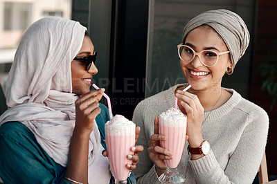 Buy stock photo Coffee shop, milkshake and Muslim with woman friends at cafe together for bonding, break or hospitality. Drink, glass and Islam with happy people at bistro or restaurant to relax for social hang out