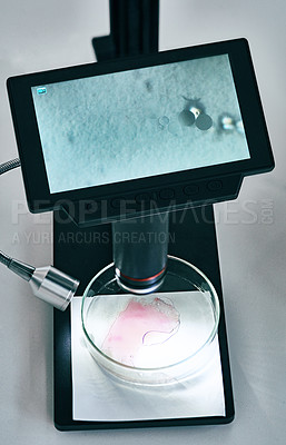 Buy stock photo Still life shot of a digital microscope showing the results of a sample liquid in a laboratory