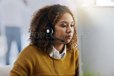 Buy stock photo Communication, computer or woman typing in call center consulting online at customer services help desk. Focus, crm agent or biracial girl consultant in telemarketing or telecom company in office