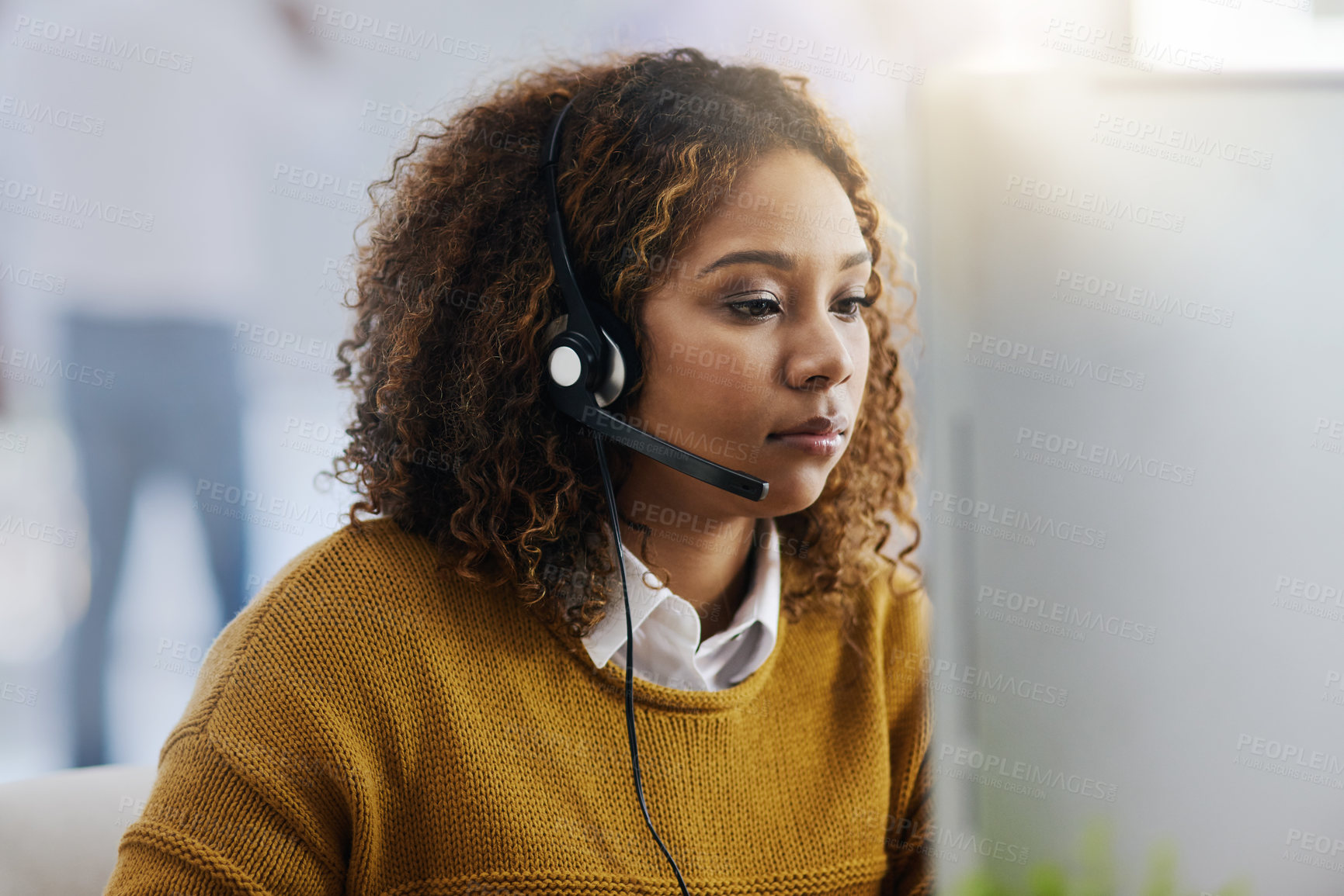 Buy stock photo Communication, computer or woman typing in call center consulting online at customer services help desk. Focus, crm agent or biracial girl consultant in telemarketing or telecom company in office