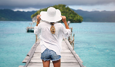 Buy stock photo Island, ocean and back of woman on deck for holiday, summer vacation and weekend getaway in Maldives. Traveling, tropical villa and female person on luxury resort for relax, happiness and adventure