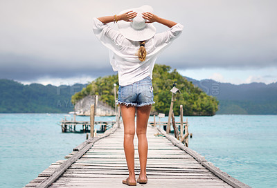 Buy stock photo Travel, ocean and back of woman on island deck for holiday, summer vacation and weekend in Maldives. Traveling, tropical villa and female person on luxury resort for relaxing, freedom and adventure