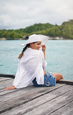 Buy stock photo Island, travel and woman relax on deck for holiday, summer vacation and weekend getaway in Maldives. Traveling, tropical ocean and female person on luxury resort for tourism, happiness and freedom