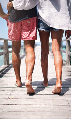 Buy stock photo Travel, island and couple walking on deck for holiday, summer vacation and weekend in Maldives. Love, tropical and legs of man and woman on luxury resort for honeymoon, anniversary and adventure