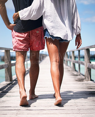Buy stock photo Couple legs, walking and boardwalk on a tropical island on vacation with freedom by sea. Ocean, beach and deck walk of a man back and woman together with love in summer on a holiday outdoor in sun