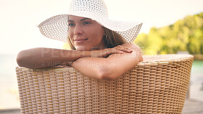 Buy stock photo Summer, fashion and woman on chair with hat for holiday, vacation and weekend outdoors. Traveling, tropical resort and female person with smile for luxury tourism, sunshine and happy at poolside