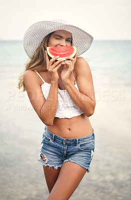 Buy stock photo Woman, watermelon and beach vacation in summer with a comic or funny smile and wink for flirting. Female person portrait with a fruit for healthy eating outdoor on a travel adventure or ocean holiday