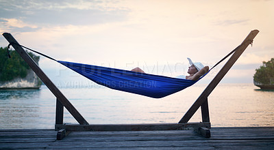 Buy stock photo Sunset, hammock and woman on vacation, relax and view on weekend break, getaway and peace. Female person, girl and tourist on summer holiday, water and peace with traveler lying down and tourism