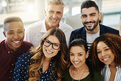 Buy stock photo Diverse group of smiling creative designers looking confident, happy and cheerful after a successful meeting in office. Portrait of ambitious team of entrepreneurs ready for success in global startup