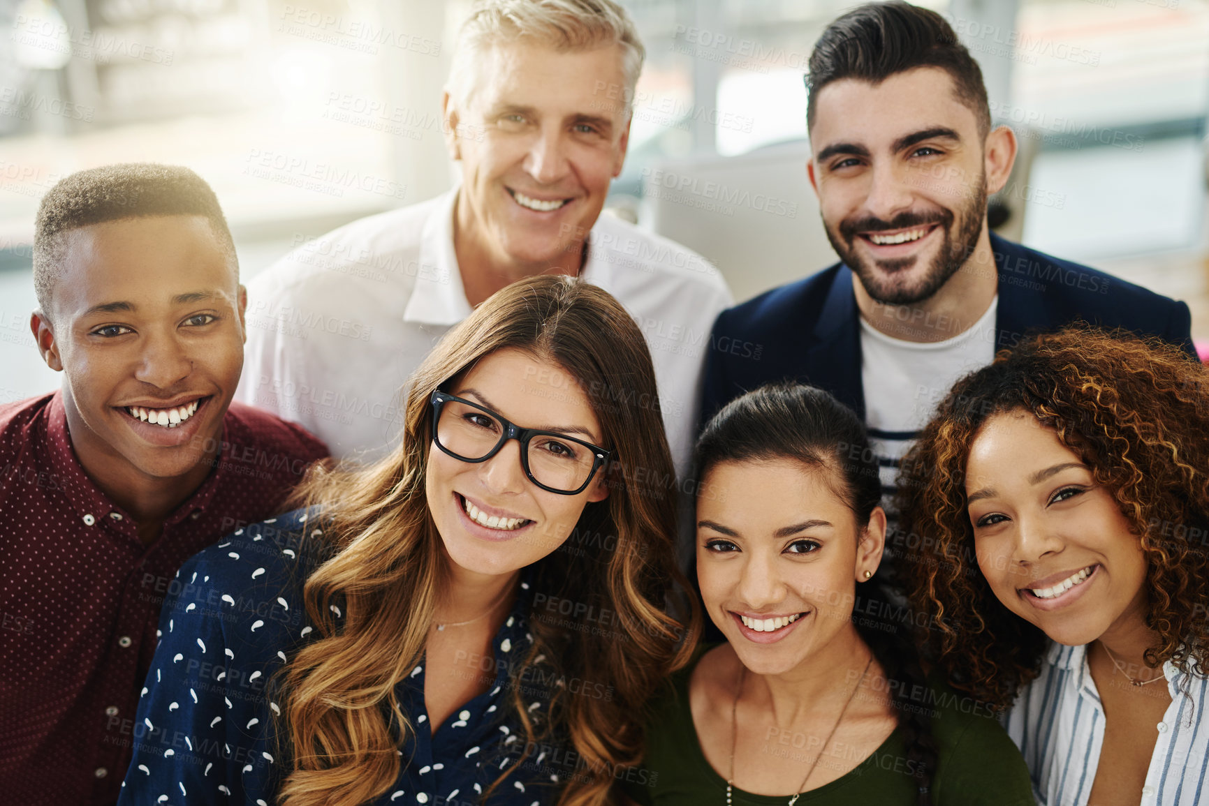 Buy stock photo Diverse group of smiling creative designers looking confident, happy and cheerful after a successful meeting in office. Portrait of ambitious team of entrepreneurs ready for success in global startup