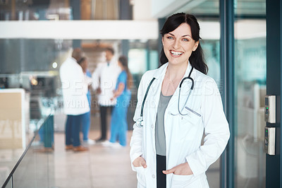 Buy stock photo Portrait, happy woman and proud doctor in hospital for healthcare services, career and medicine. Face, medical professional and confident physician with smile at wellness clinic ready for nursing