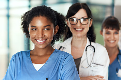 Buy stock photo Portrait of a diverse team of doctors standing together in a hospital