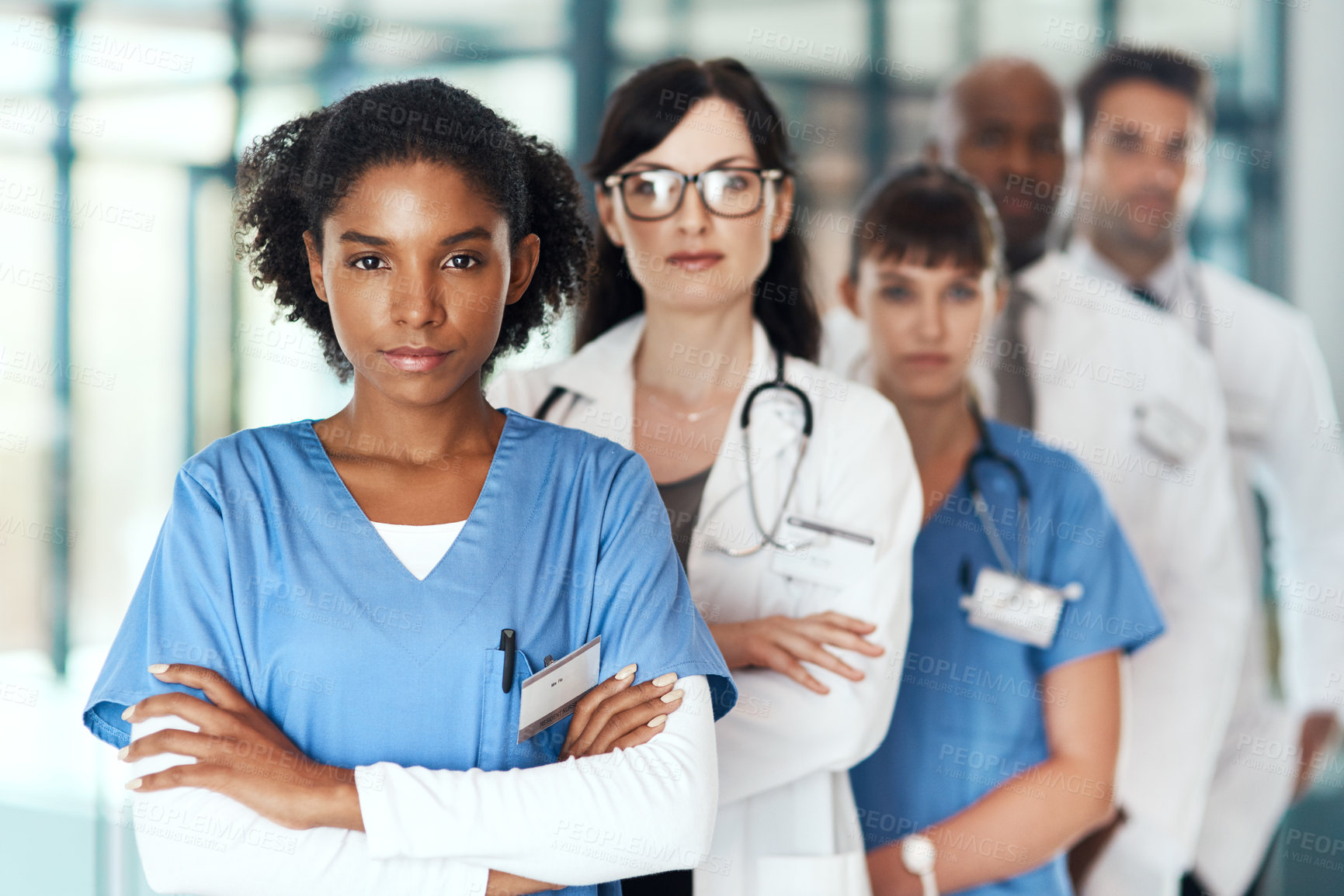 Buy stock photo Portrait, teamwork or confident nurses with arms crossed in hospital for healthcare services or about us. Nursing leadership, medical professional and doctors with pride or trust at wellness clinic