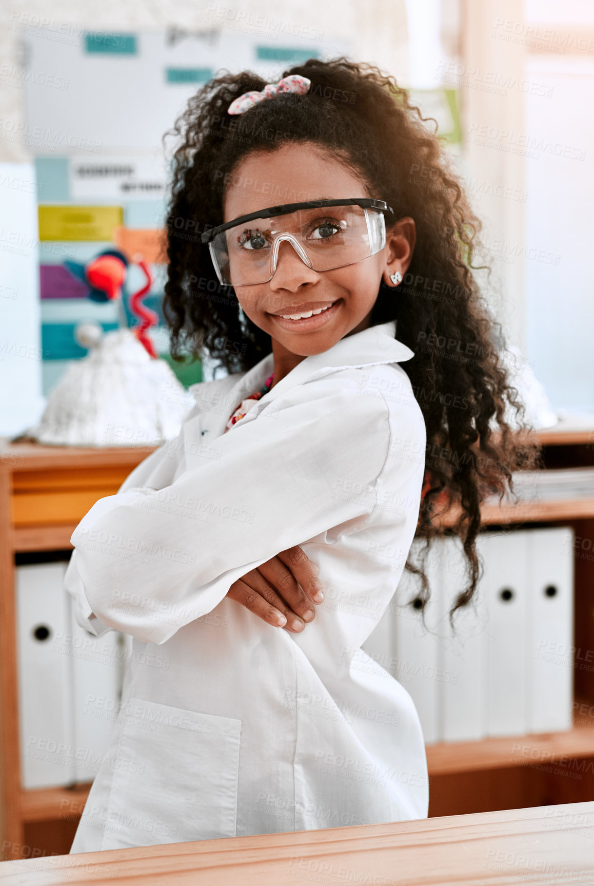 Buy stock photo African child, portrait and student in lab coat with arms crossed for learning, education or confident. Face, girl and happy kid in science class with goggles to study physics or knowledge at school