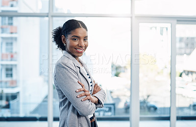 Buy stock photo Confident, happy and ambitious woman with standing with her arms crossed and showing good leadership skills in a modern office. Portrait of a smiling business intern ready for a successful future