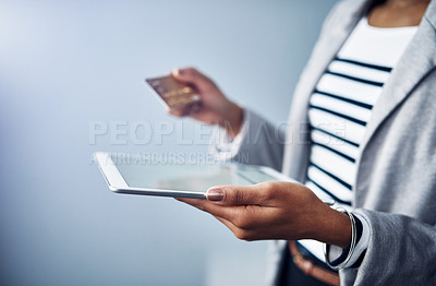 Buy stock photo Woman, tablet in hands with credit card and online shopping, ecommerce and fintech on studio background. Digital payment, finance and professional female person with internet banking and connectivity