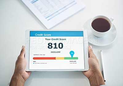 Buy stock photo Shot of an unrecognizable businesswoman holding a digital tablet showing her credit score