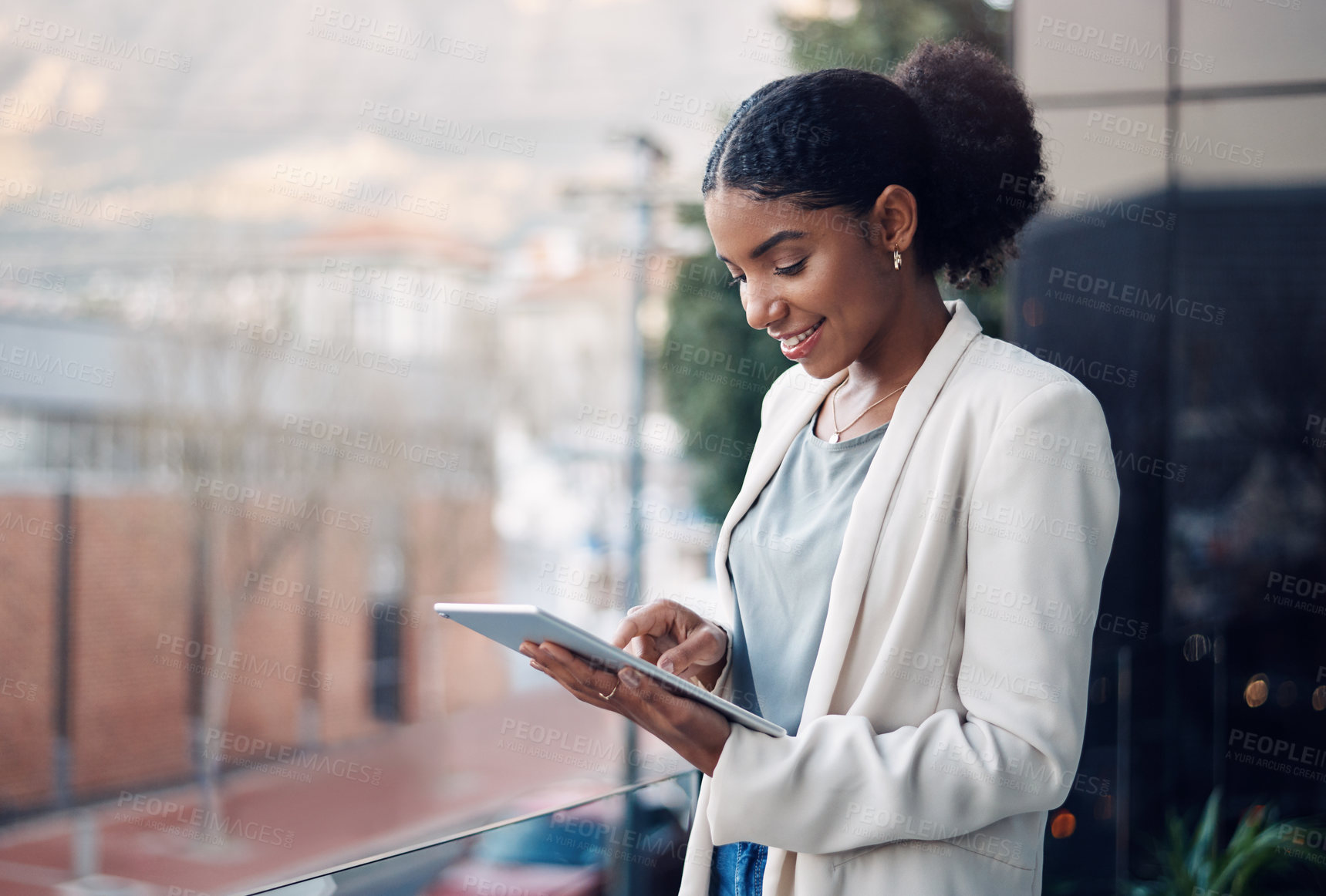 Buy stock photo Modern business woman on a tablet during a work break alone outside. Smiling corporate worker looking at web and social media posts on a balcony. Female employee on a digital device with copyspace