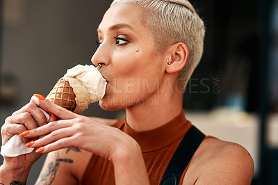 Buy stock photo Cropped shot of a young woman enjoying a ice cream cone outdoors