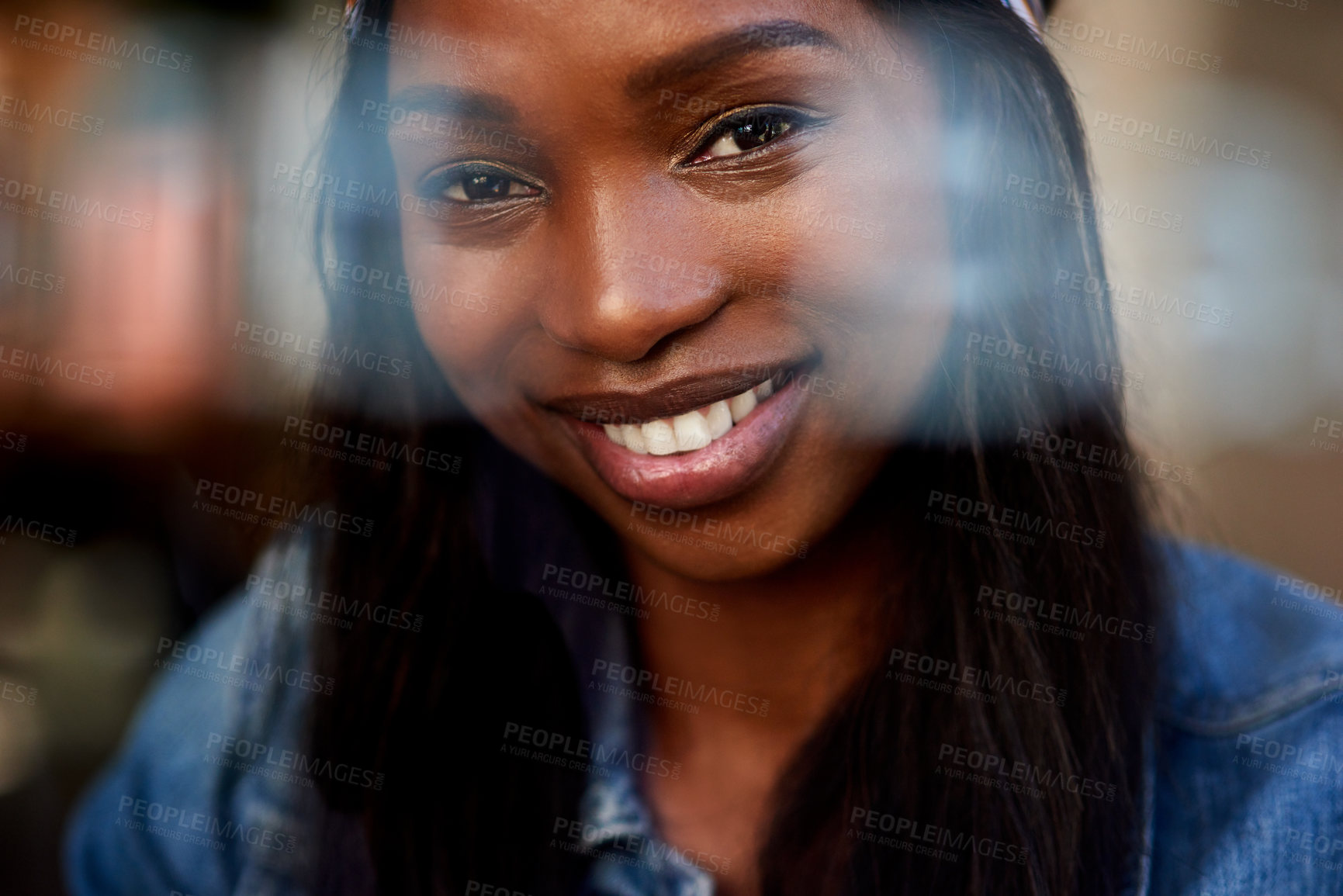 Buy stock photo Closeup portrait of an attractive young woman captured through a glass window inside a cafe