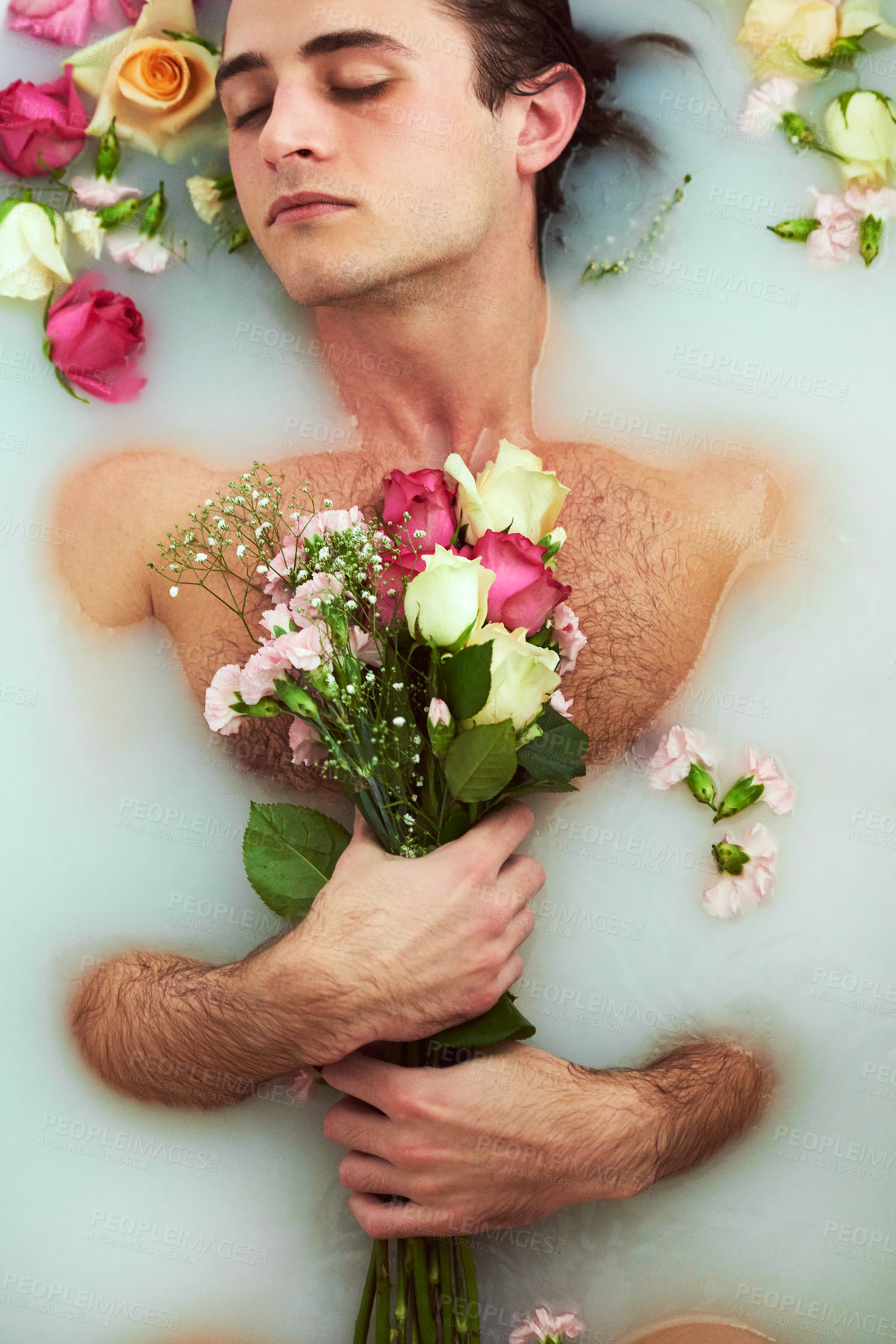 Buy stock photo Bouquet, relax and man with flowers in bath for skincare, organic treatment and natural dermatology. Top view, peace and male person with floral bunch in water for self care, grooming and wellness