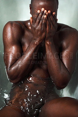 Buy stock photo Shot of a muscular young man having a bath at home