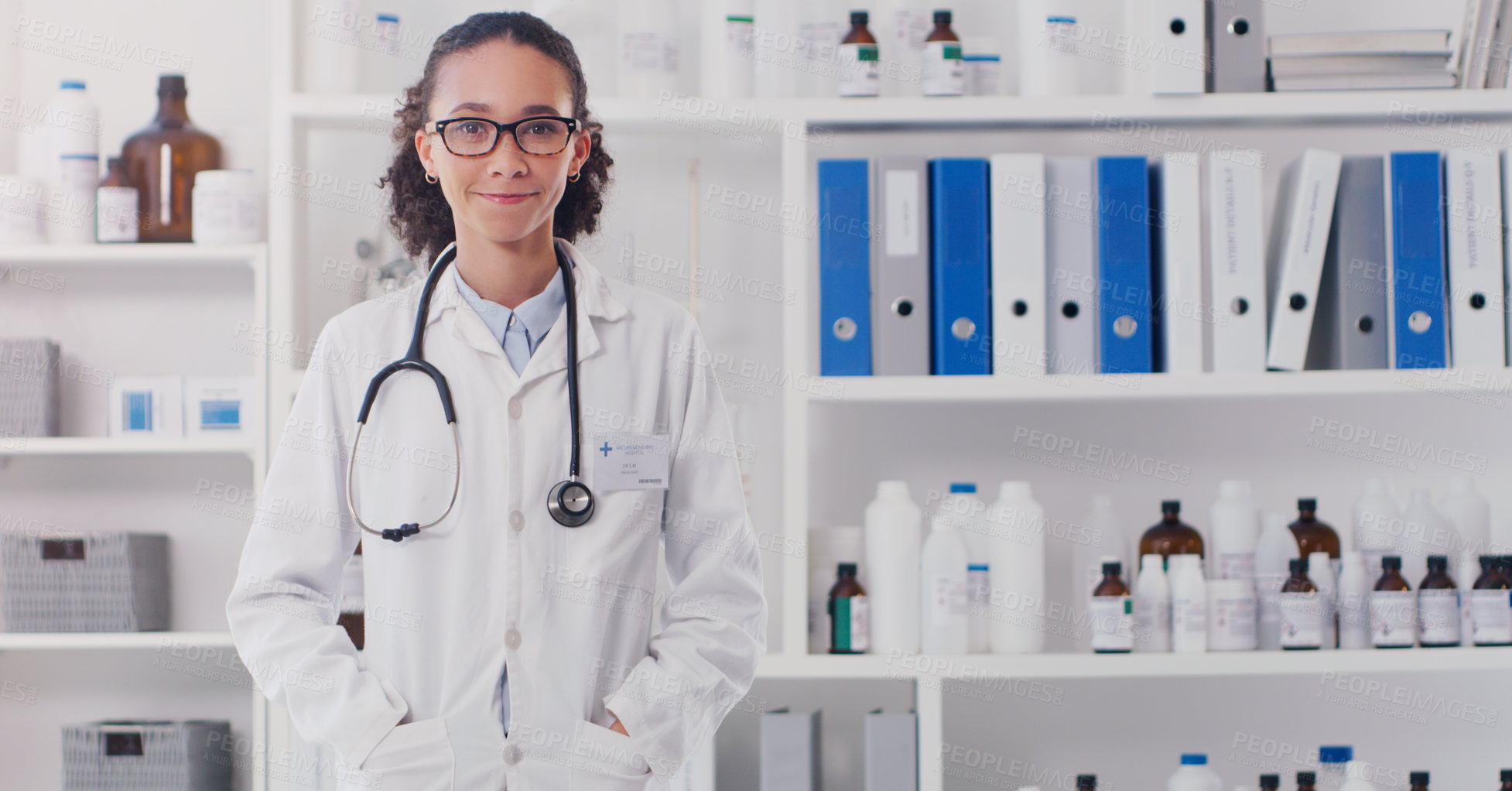 Buy stock photo Portrait of a young doctor standing in a lab