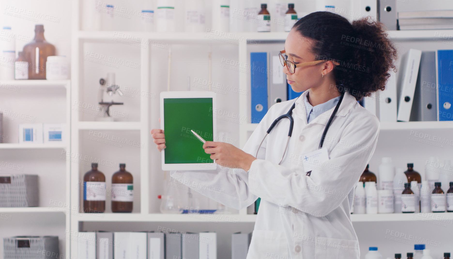 Buy stock photo Woman, doctor and tablet with green screen in lab for mockup, pointing and telehealth. Tech, female surgeon and chroma key in hospital for pharmaceutical research, show and medical advice for patient