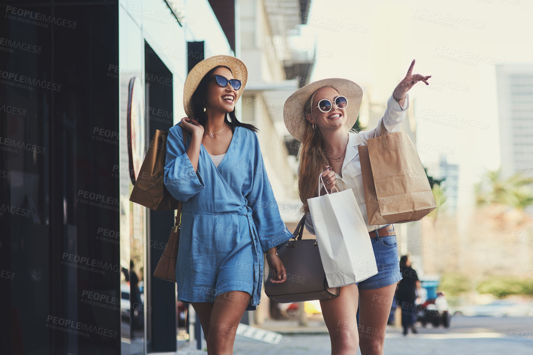 Buy stock photo Pointing, friends and happy women with shopping bags in city for fashion sunglasses, discount or luxury clothes. Black Friday, girls or gift outdoor at mall for retail, street promotion or sales deal