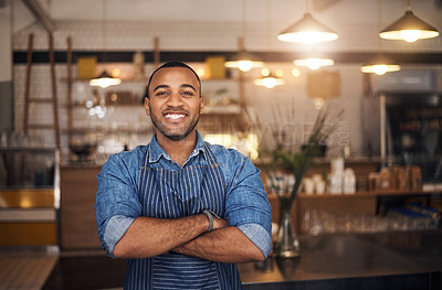 Buy stock photo Coffee shop, waiter and portrait of African man in restaurant for service, working and crossed arms in cafe. Small business owner, bistro startup and male barista smile in cafeteria ready to serve