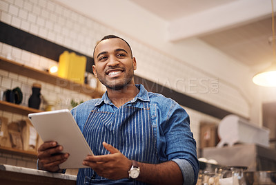 Buy stock photo Happy, tablet and waiter with man in cafe for online, entrepreneurship and startup. African, technology and food industry with small business owner in restaurant for barista, network and coffee shop