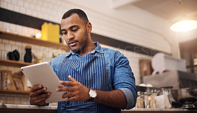 Buy stock photo Focus, tablet and manager with man in cafe for online, entrepreneurship and startup. Waiter, technology and food industry with small business owner in restaurant for barista, african and coffee shop