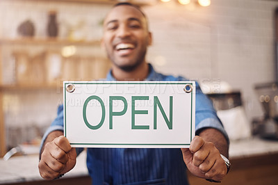 Buy stock photo Open, sign and closeup of man in shop, store and advertising notice of retail shopping time, board or trading information. Hands of happy cafe owner with opening banner, welcome and startup services