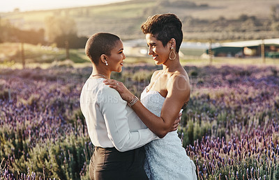 Buy stock photo Woman, lesbian couple and hug with smile for wedding, marriage or commitment in pride and support for LGBT in nature. Happy gay married women hugging, smiling and enjoying celebration in love outside