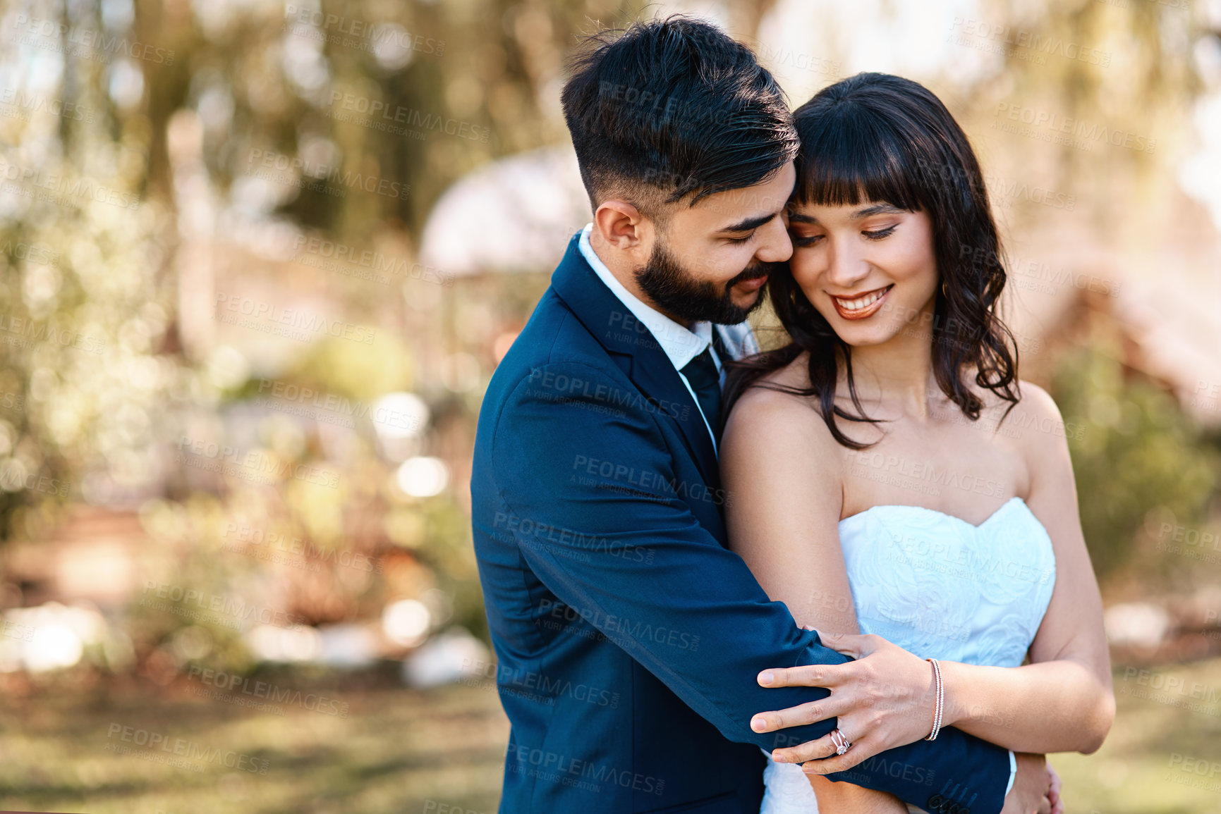 Buy stock photo Couple, love and hug on wedding day in nature, happy and commitment for marriage or relationship. People, embrace and smile in outdoor ceremony, partnership and celebration of forever or bonding