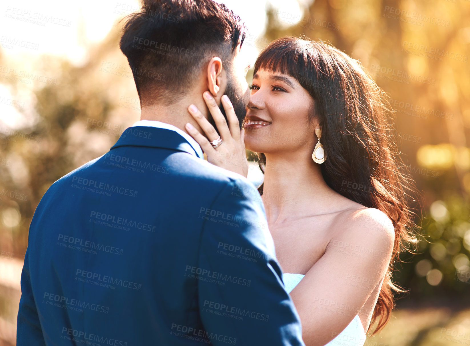 Buy stock photo Love, face and couple at sunset in wedding for celebration of marriage and happiness. Bride, groom and people show care and support in romantic commitment with luxury outdoor event in summer