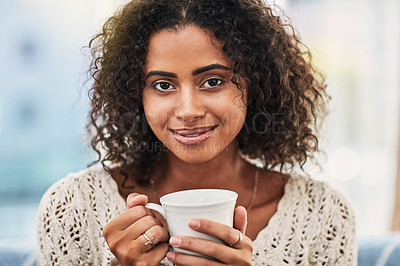 Buy stock photo Woman, portrait and relax in home with cup, weekend peace and hot beverage for comfort on couch. Female person, cappuccino and chilling in living room with espresso, break and coffee in Morocco