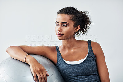 Buy stock photo Woman, thinking or dream with exercise ball for workout, training or balance in fitness at home. Young, active or female person in wonder, contemplating or routine for pilates, health or wellness