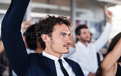 Buy stock photo Cropped shot of a group of businesspeople raising their hands to ask questions during a conference