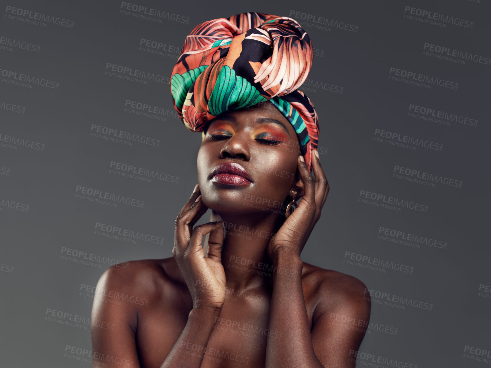 Buy stock photo Beauty, makeup and black woman with a turban in studio with a elegant, glam and cosmetic face. Beautiful, young and African female model with a head wrap with sensual pose isolated by gray background