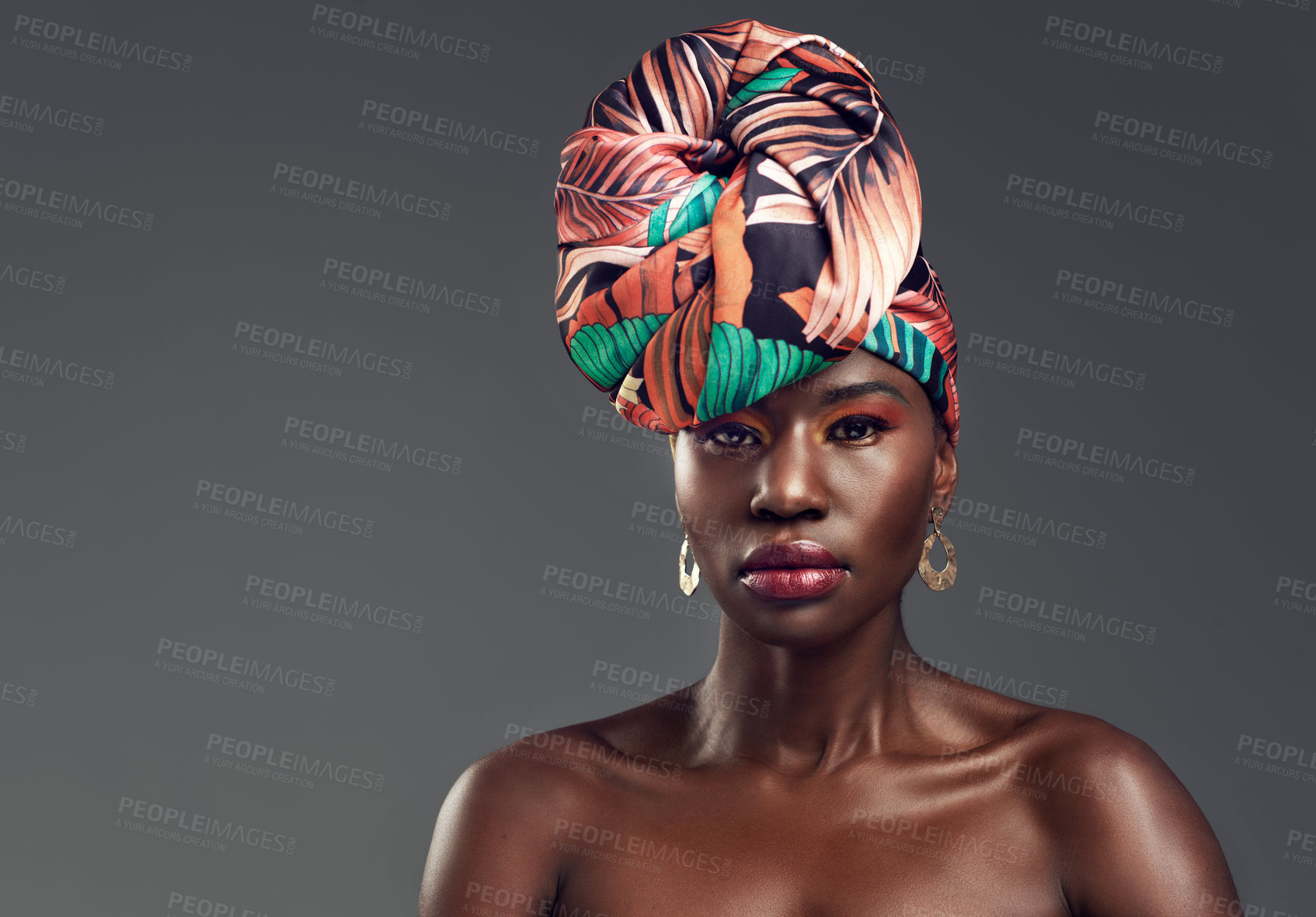 Buy stock photo Portrait, head wrap and black woman with fashion, beauty and confident on a grey studio background. Face, female person and model with traditional turban, cosmetics and makeup with skincare or mockup