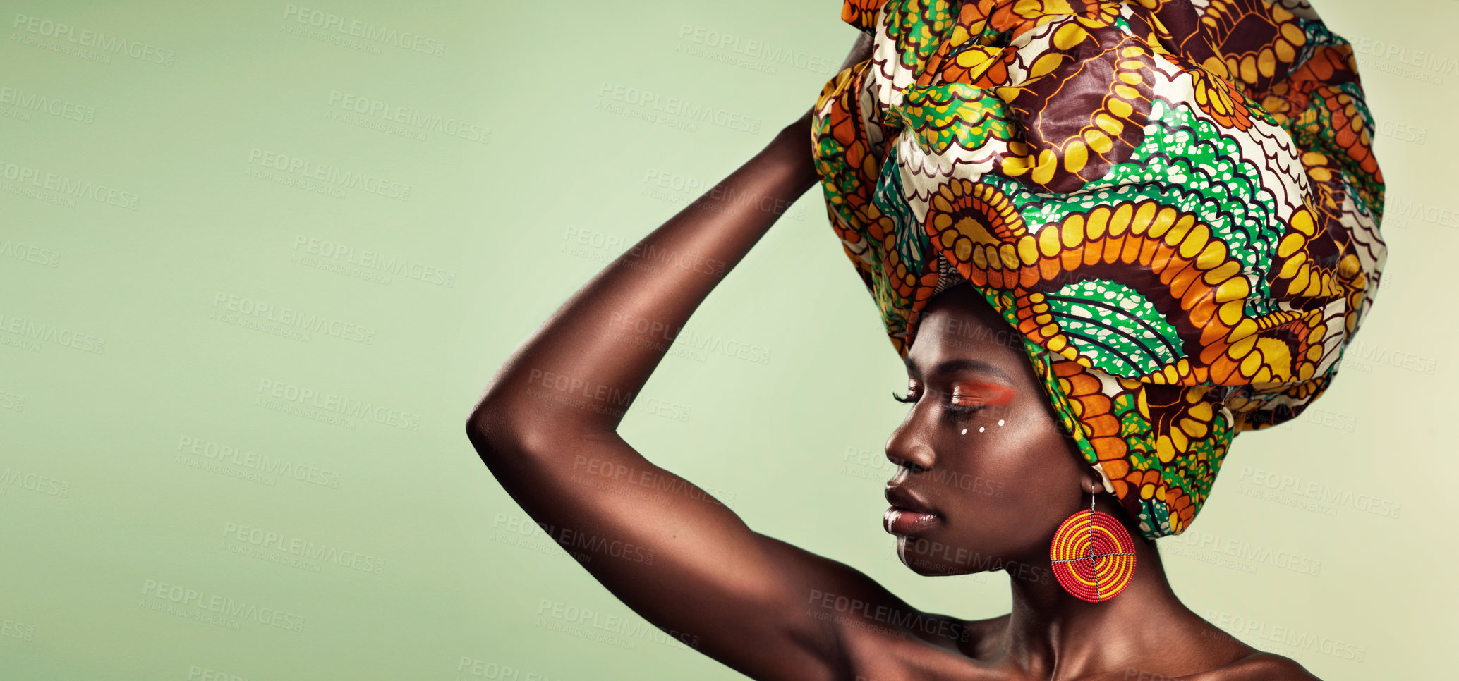Buy stock photo Makeup, fashion and black woman in head wrap in studio for culture, glow and cosmetics on green background with space. Beauty, skincare and african female model with pride, tradition and confidence