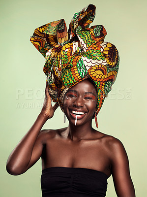Buy stock photo Beauty, black woman and portrait with African head scarf and smile in a studio. Isolated, green background traditional Africa wrap with a young female model with culture and pride with cosmetics