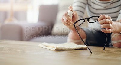 Buy stock photo Hands, woman cleaning glasses and spray bottle with chemical liquid, cloth and hygiene with lens maintenance. Clean spectacles, eyewear and female cleaner at home with eye care and mockup space