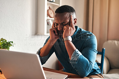 Buy stock photo Stress, pain and headache while working remote on laptop from home office, freelance man annoyed and under pressure. Frustrated male suffering from a migraine, pressure from workload or a deadline