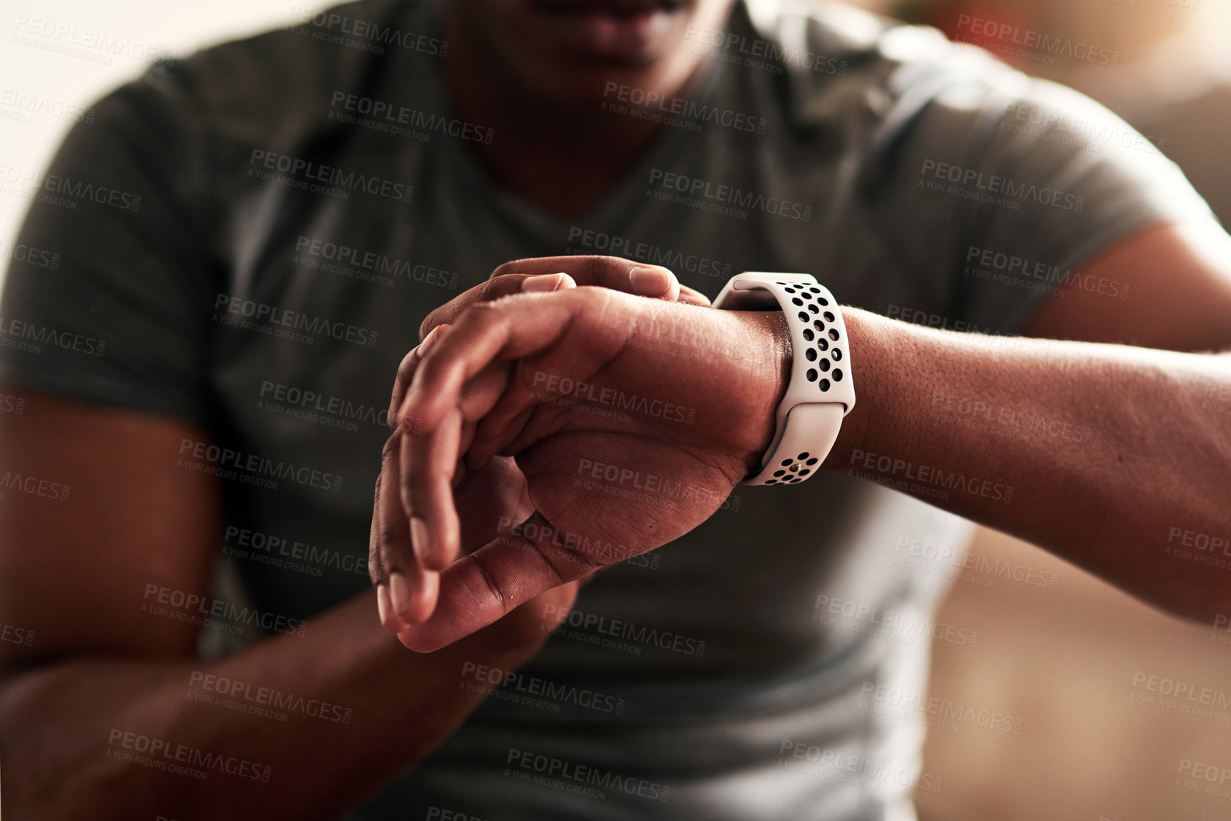 Buy stock photo Cropped shot of an unrecognizable man checking his wristwatch