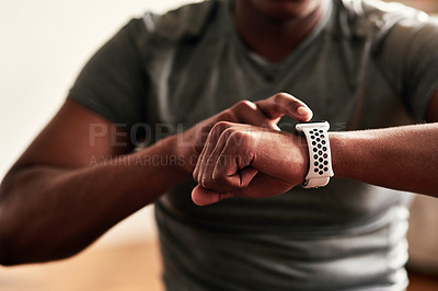 Buy stock photo Cropped shot of an unrecognizable man checking his wristwatch