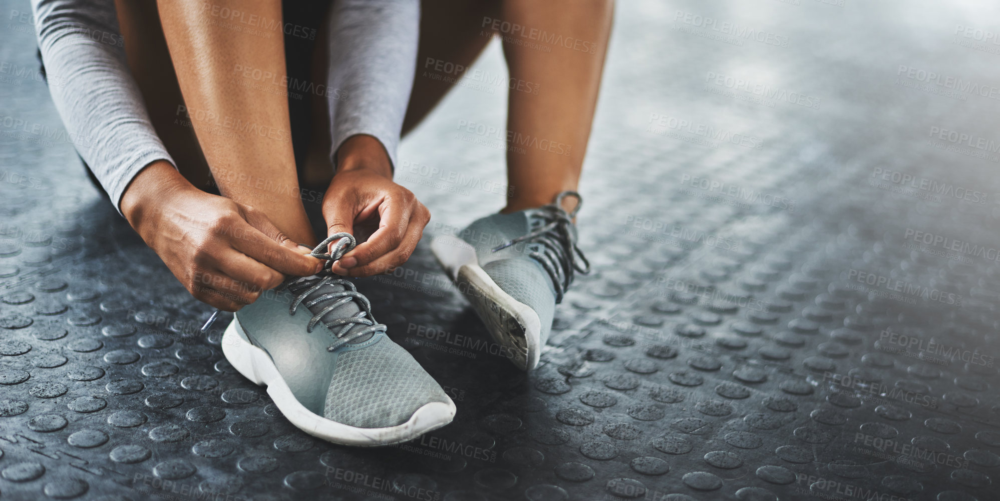 Buy stock photo Floor, fitness and hands tie shoes in gym before workout for exercise, training or healthy lifestyle in morning. Sports, wellness and person on ground for prepare, fasten sneakers or ready to start