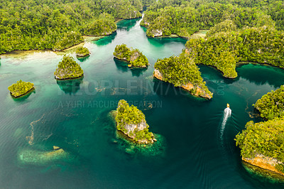 Buy stock photo High angle shot of a little islets and islands in the middle of Indonesia